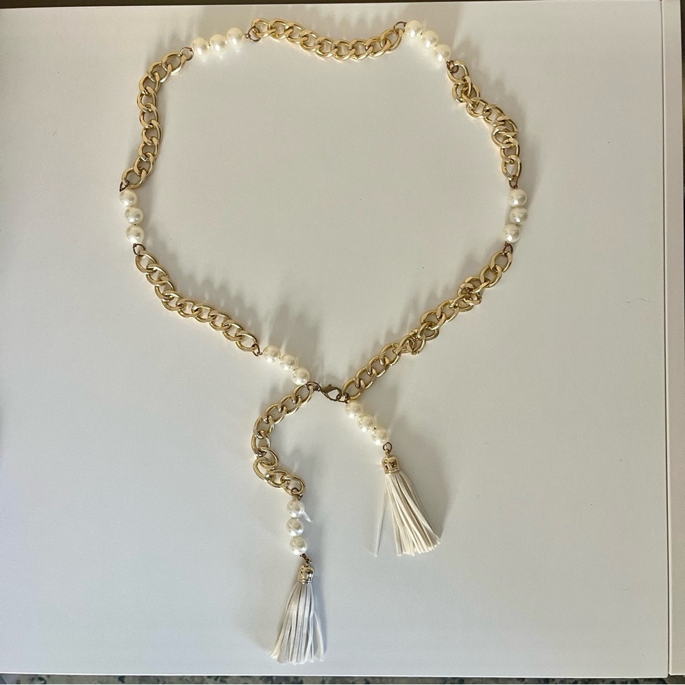 Gold chain and pearl waist belt with leather tassels